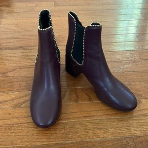 Burgundy leather Coach boots with gold stud detail